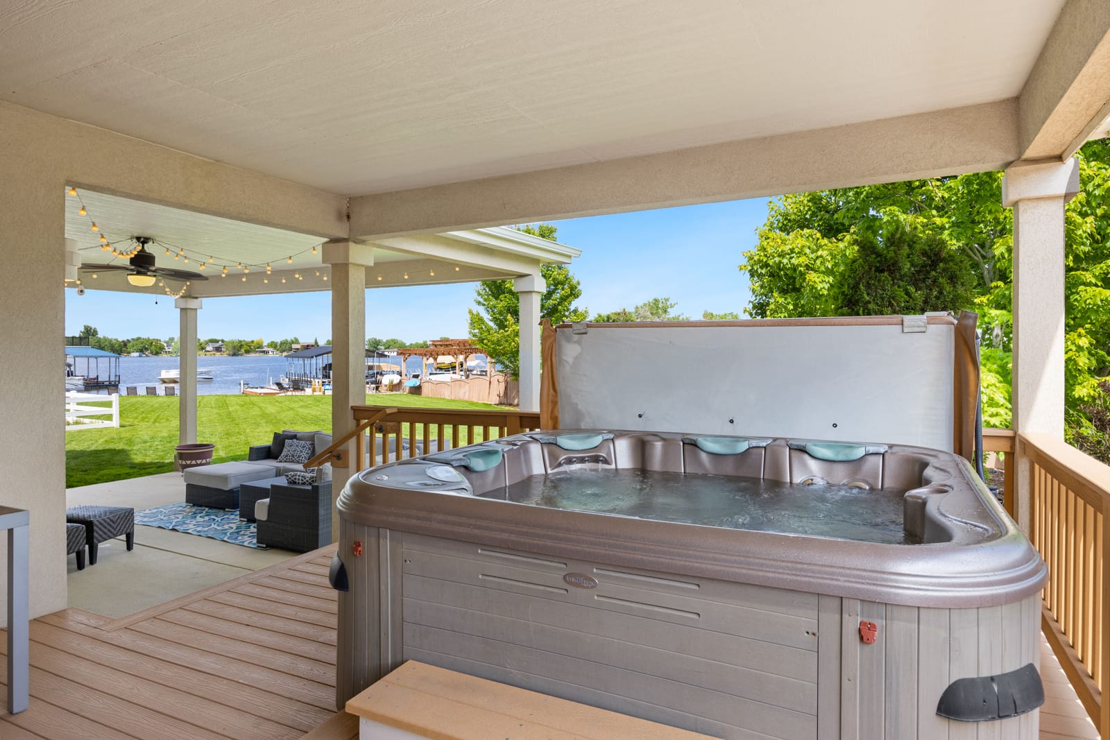 An outdoor hot tub on a covered terrace, the kind that has to come apart before it can leave